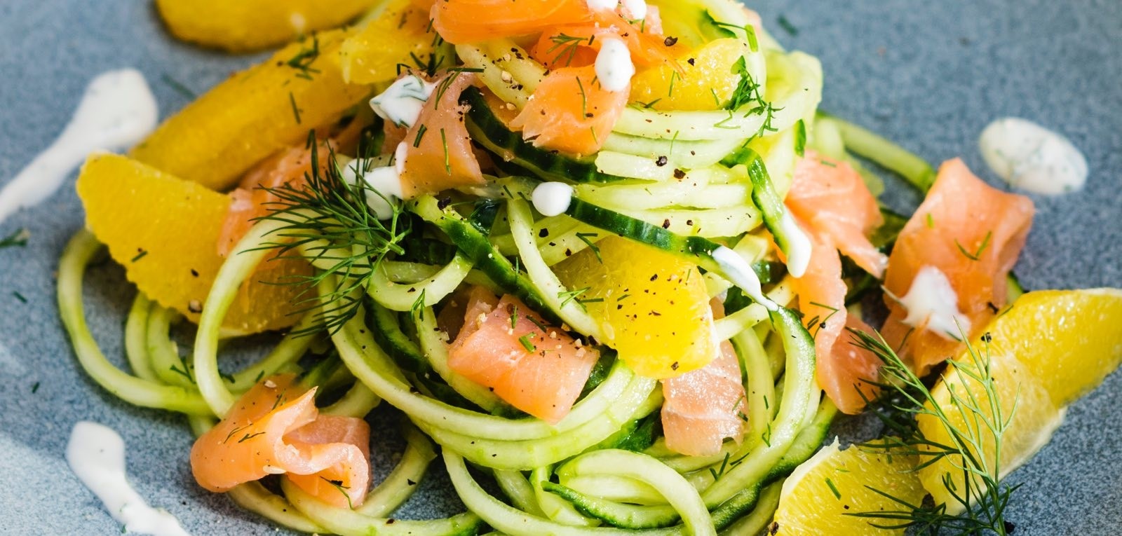 Cucumber noodles salad with smoked salmon, dill and sour cream